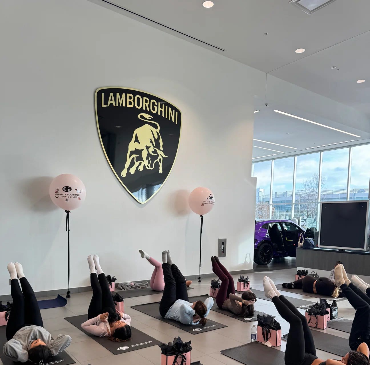 Team enjoying a private puppy yoga holiday party